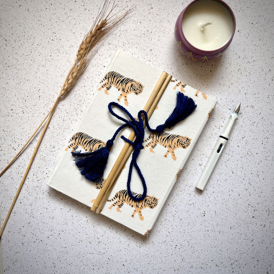 Tiger Print Yellow Diary styled flatlay with writing accessories