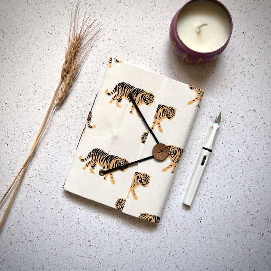 Tiger Print Yellow Diary styled flatlay with writing accessories