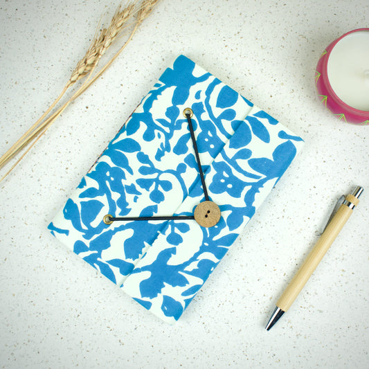 Abstract Blue Diary styled flatlay with writing accessories