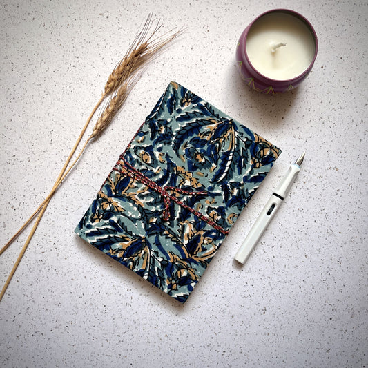 Indigo Floral Blue Diary styled flatlay with writing accessories