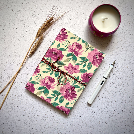 Soft Botanical Pink Diary styled flatlay with writing accessories