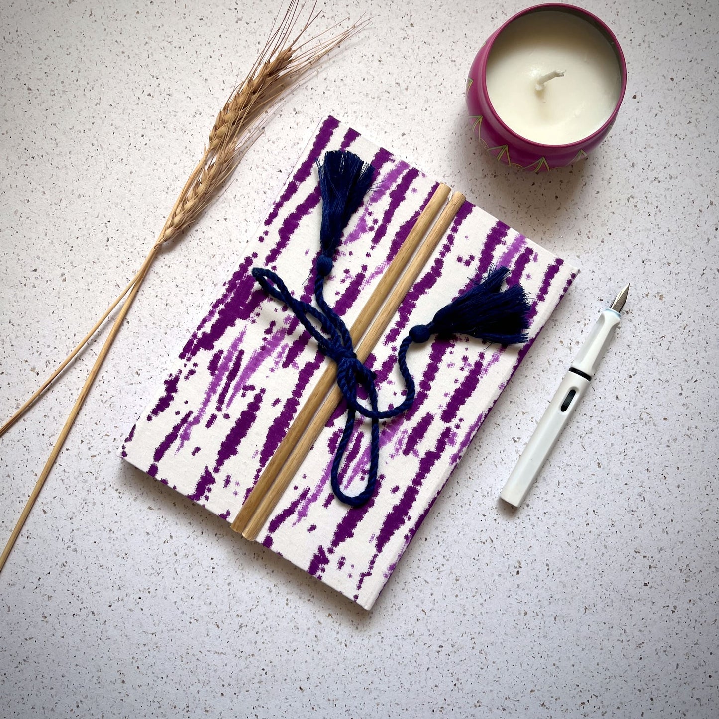 Abstract Stripe Purple Diary styled flatlay with writing accessories