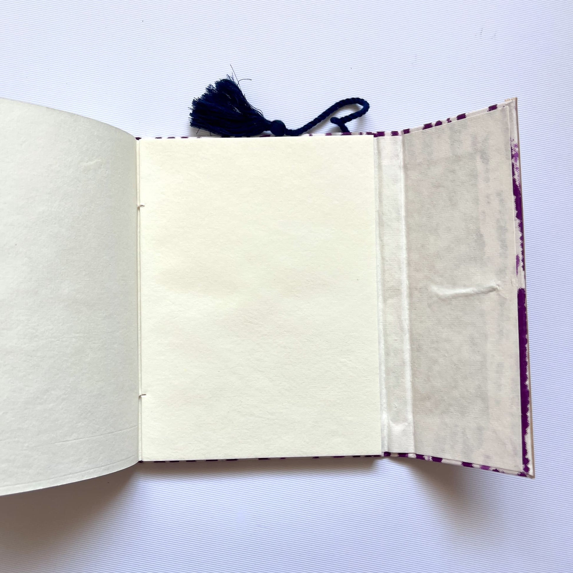 Abstract Stripe Purple Diary opened to show handmade paper pages