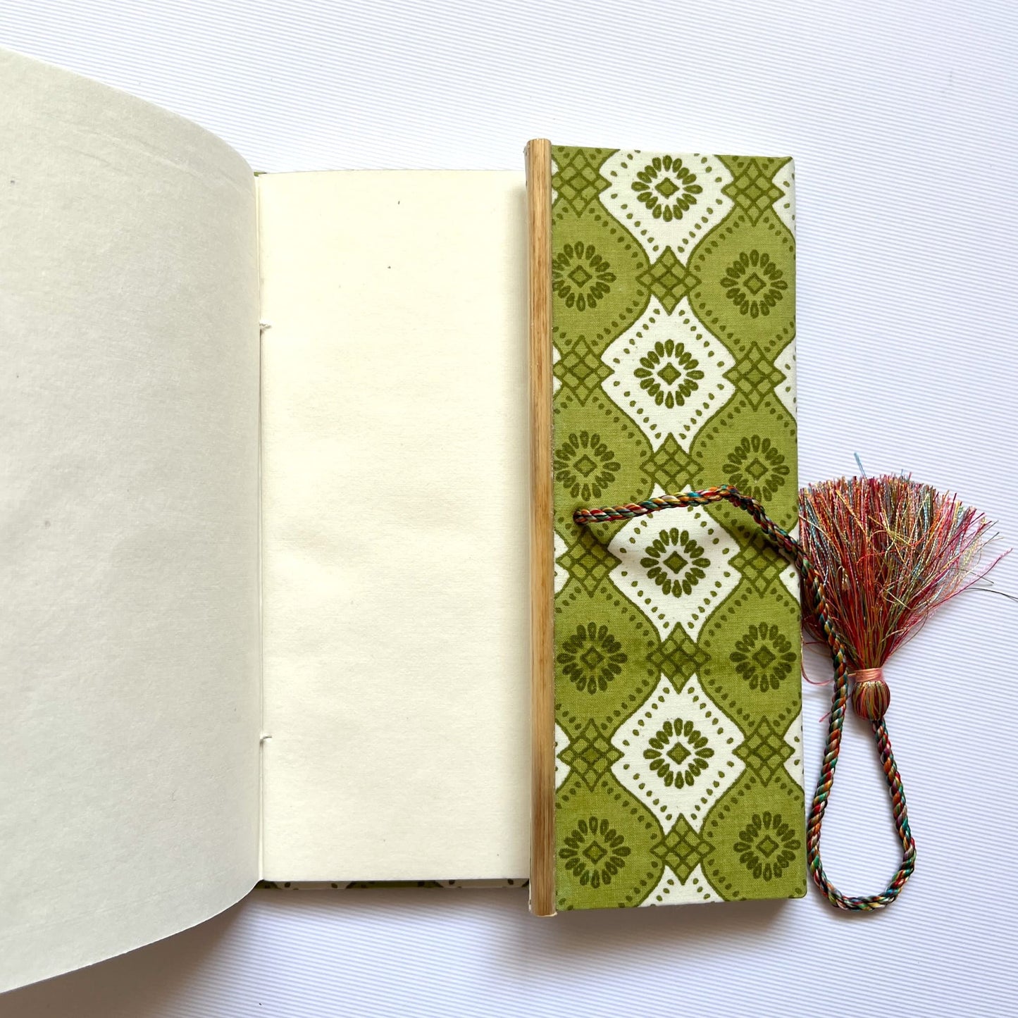 Geometric Tile Green Diary opened to show handmade paper pages