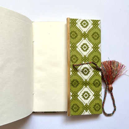 Geometric Tile Green Diary opened to show handmade paper pages