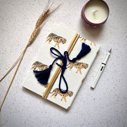 Tiger Print Yellow Diary styled flatlay with writing accessories