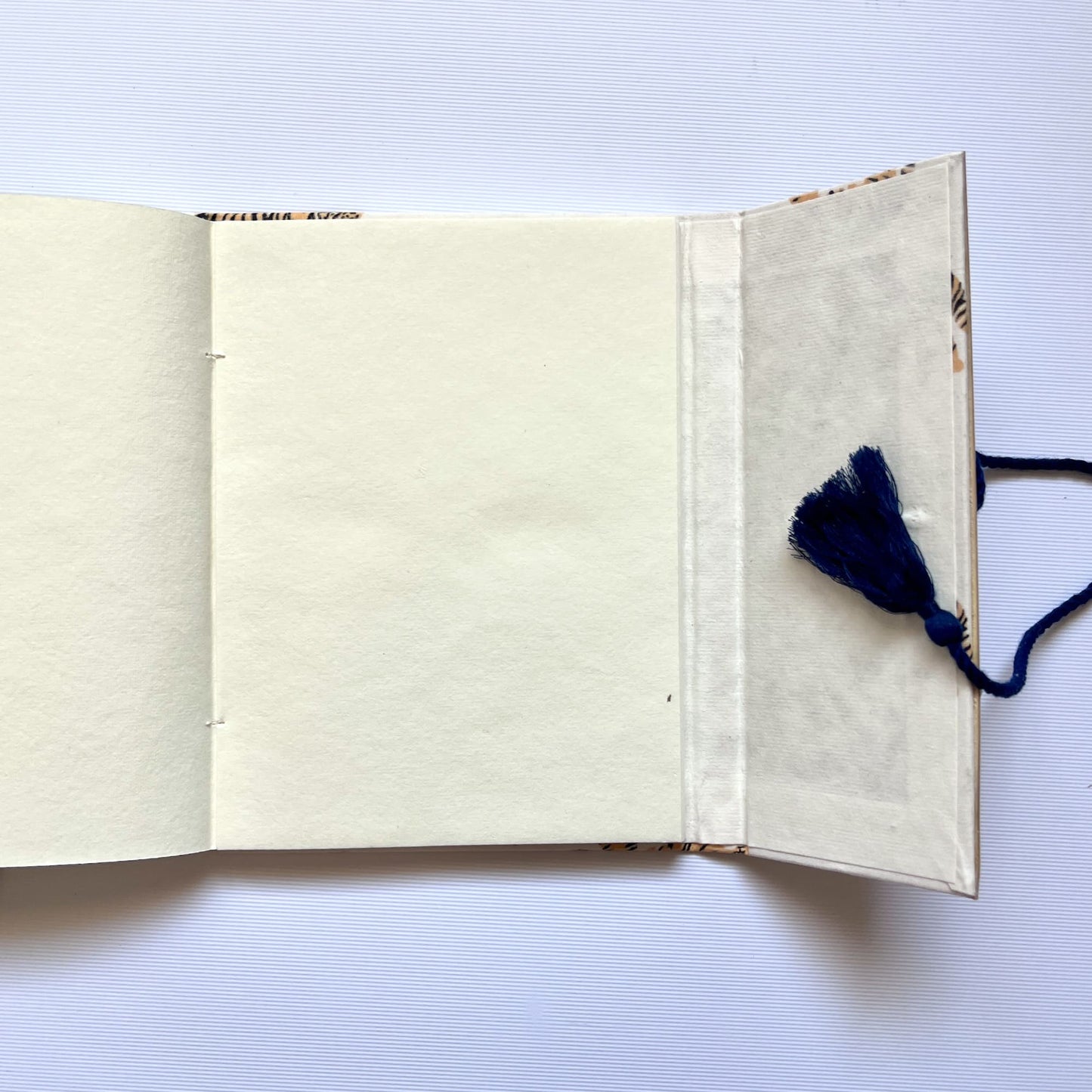 Tiger Print Yellow Diary opened to show handmade paper pages