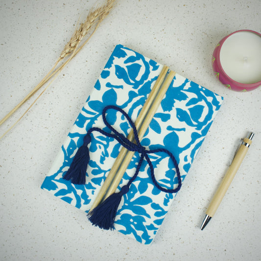 Floral Block Blue Diary styled flatlay with writing accessories