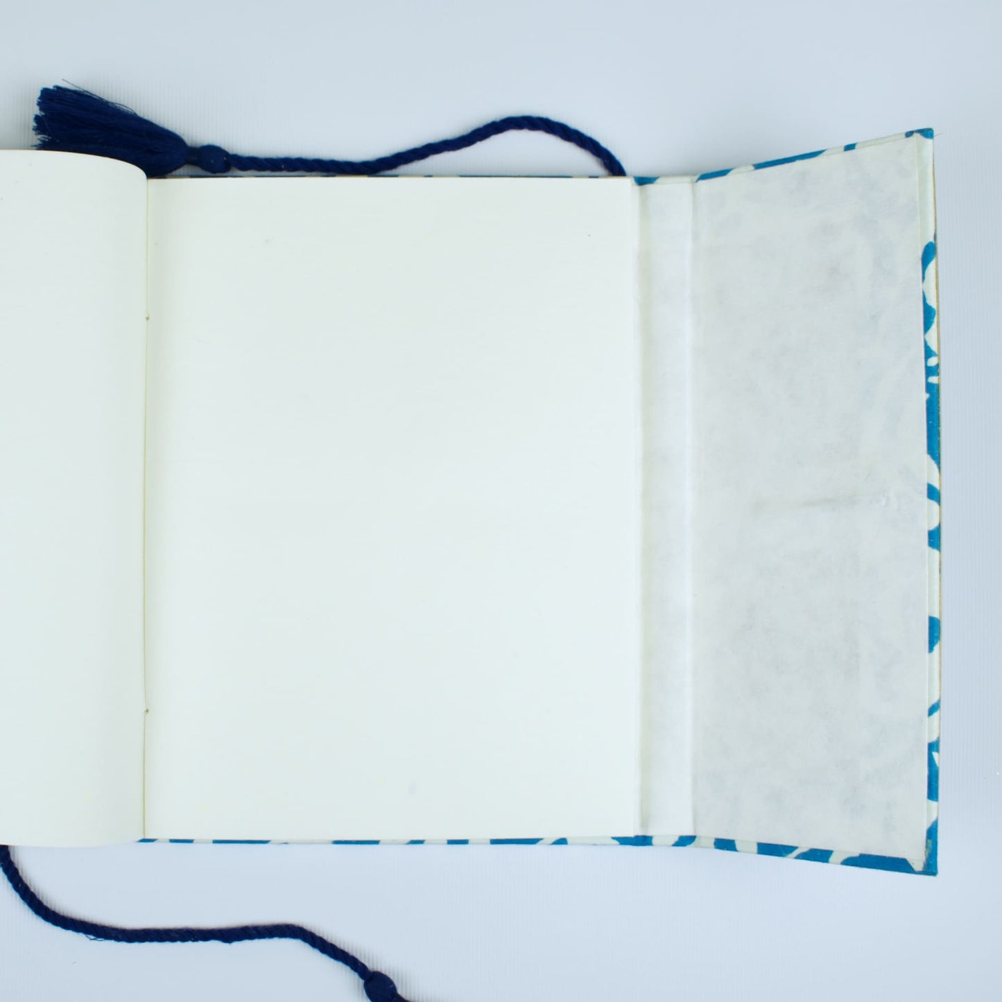 Floral Block Blue Diary opened to show handmade paper pages