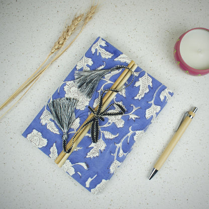 Floral Vine Blue Diary styled flatlay with writing accessories