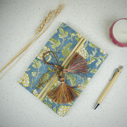 Mughal Floral Blue Diary styled flatlay with writing accessories