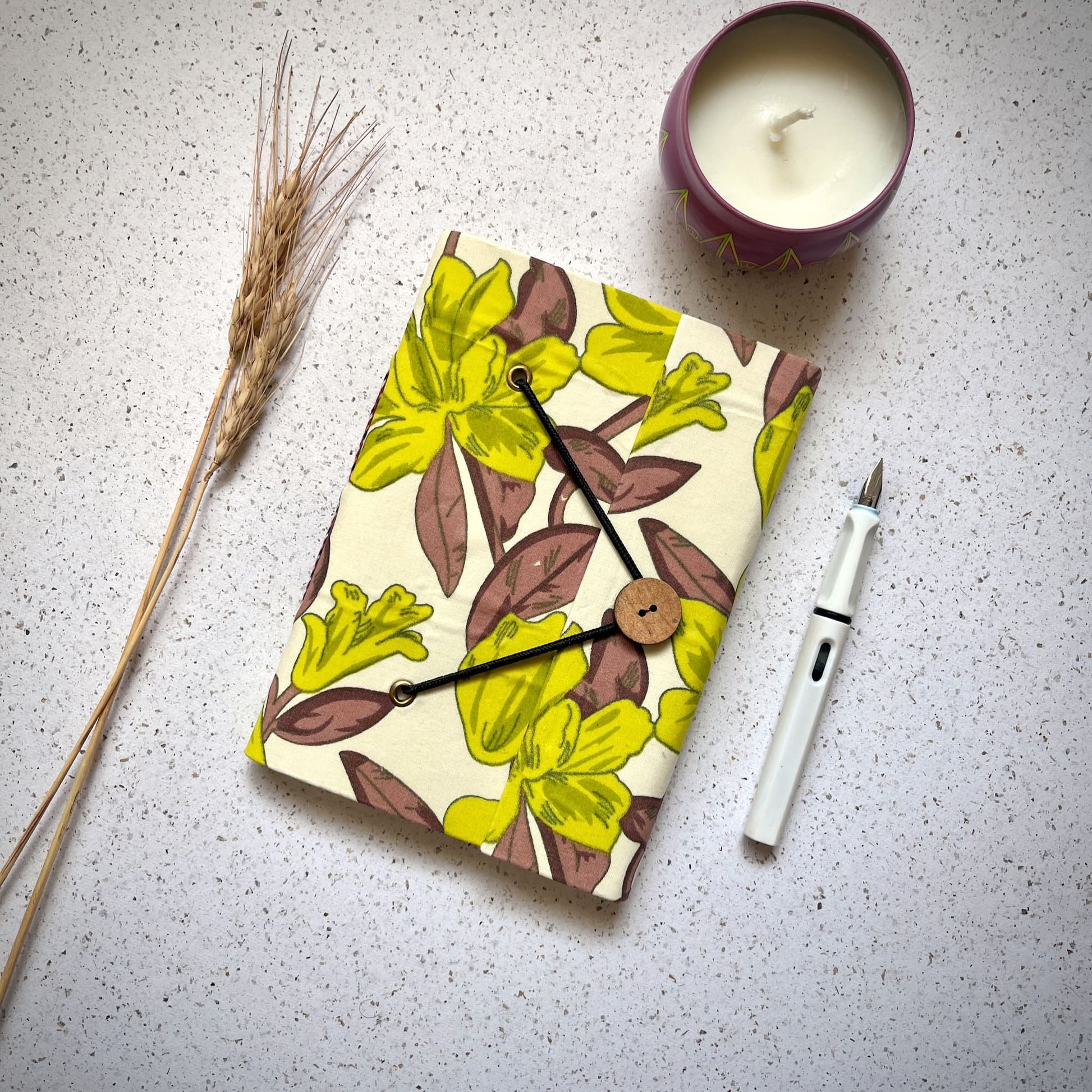 Large Floral Green Diary styled flatlay with writing accessories