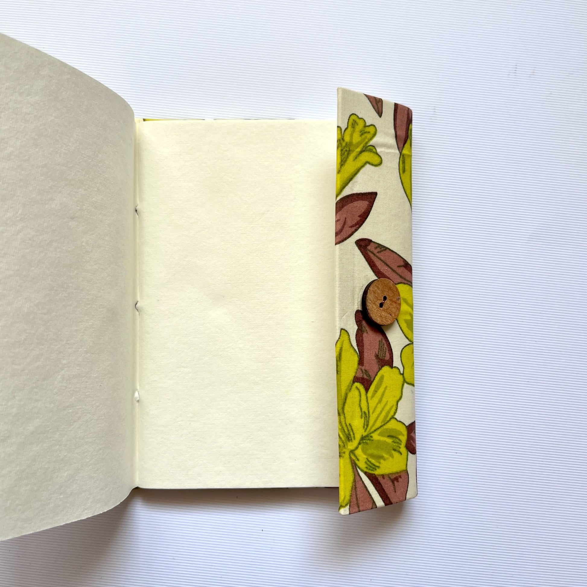 Large Floral Green Diary opened to show handmade paper pages