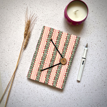 Berry Stripe Pink Diary styled flatlay with writing accessories