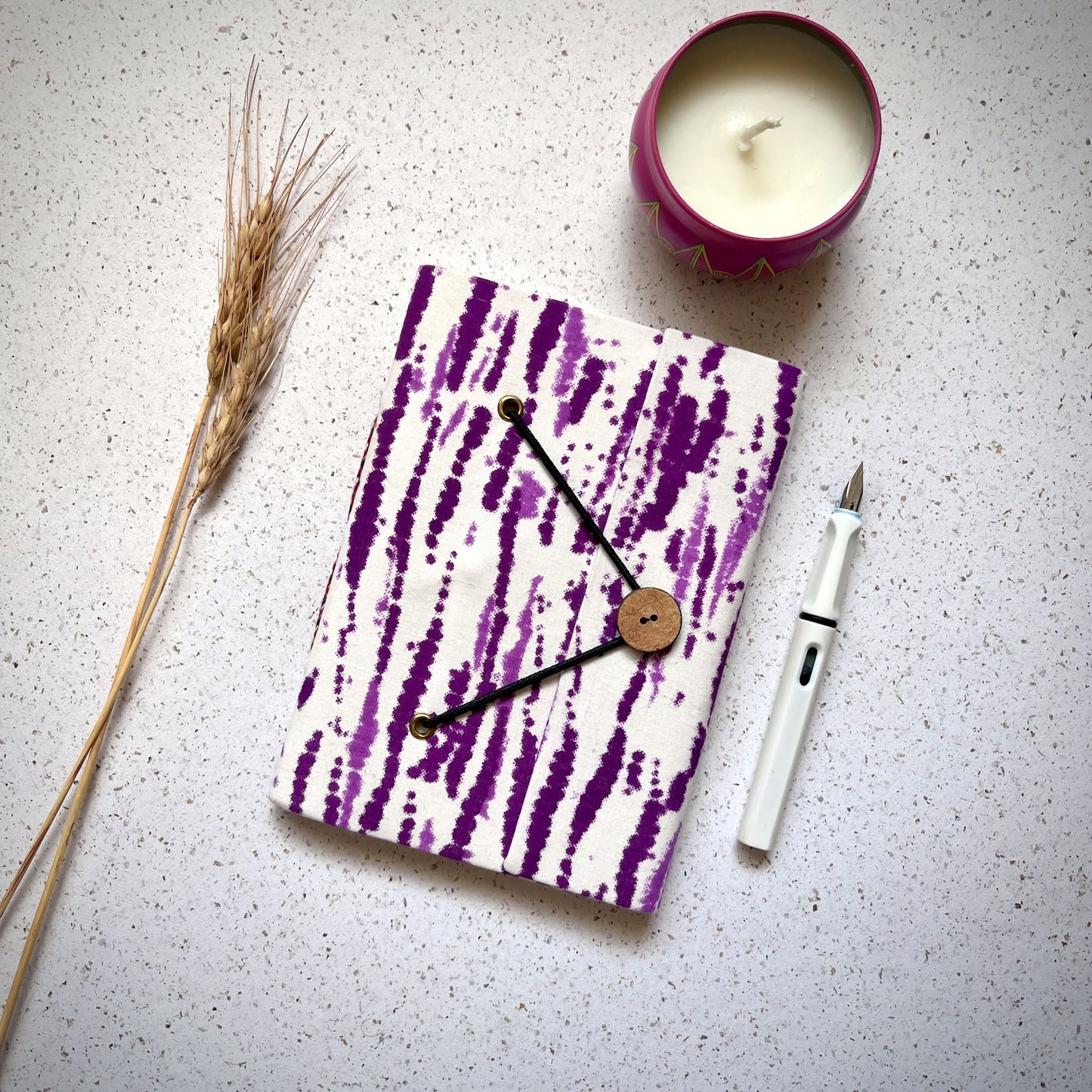 Abstract Stripe Purple Diary styled flatlay with writing accessories