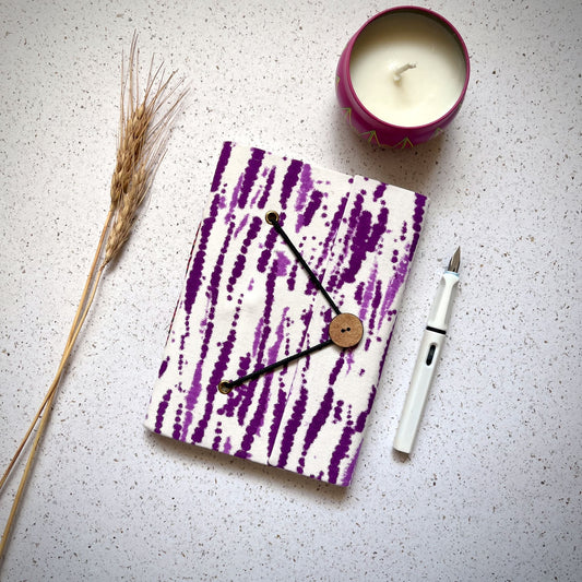 Abstract Stripe Purple Diary styled flatlay with writing accessories