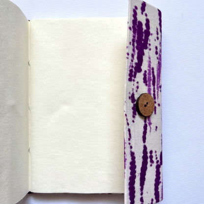 Abstract Stripe Purple Diary opened to show handmade paper pages