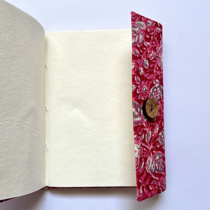 Paisley Floral Pink Diary opened to show handmade paper pages