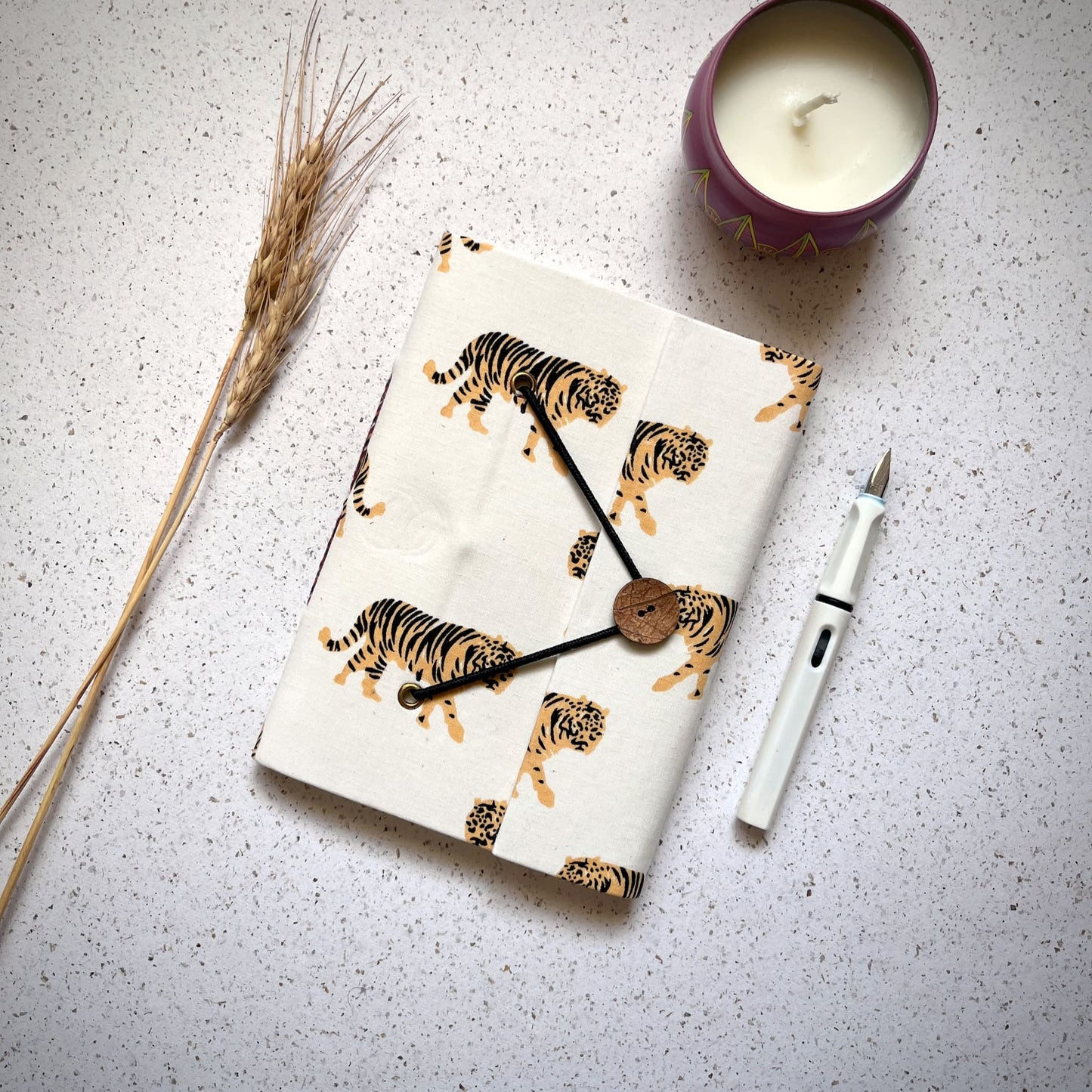 Tiger Print Yellow Diary styled flatlay with writing accessories