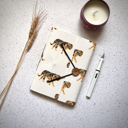 Tiger Print Yellow Diary styled flatlay with writing accessories