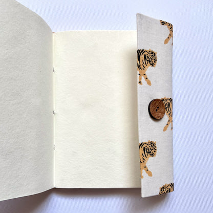 Tiger Print Yellow Diary opened to show handmade paper pages