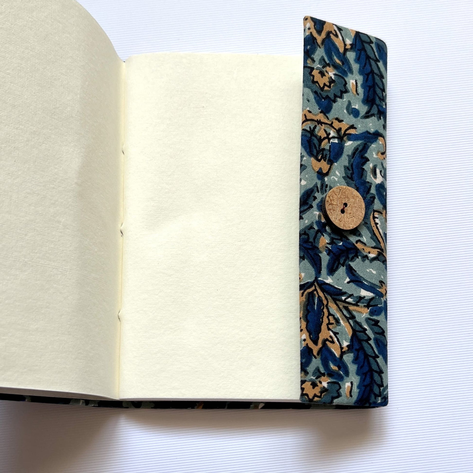 Botanical Floral Blue Diary opened to show handmade paper pages