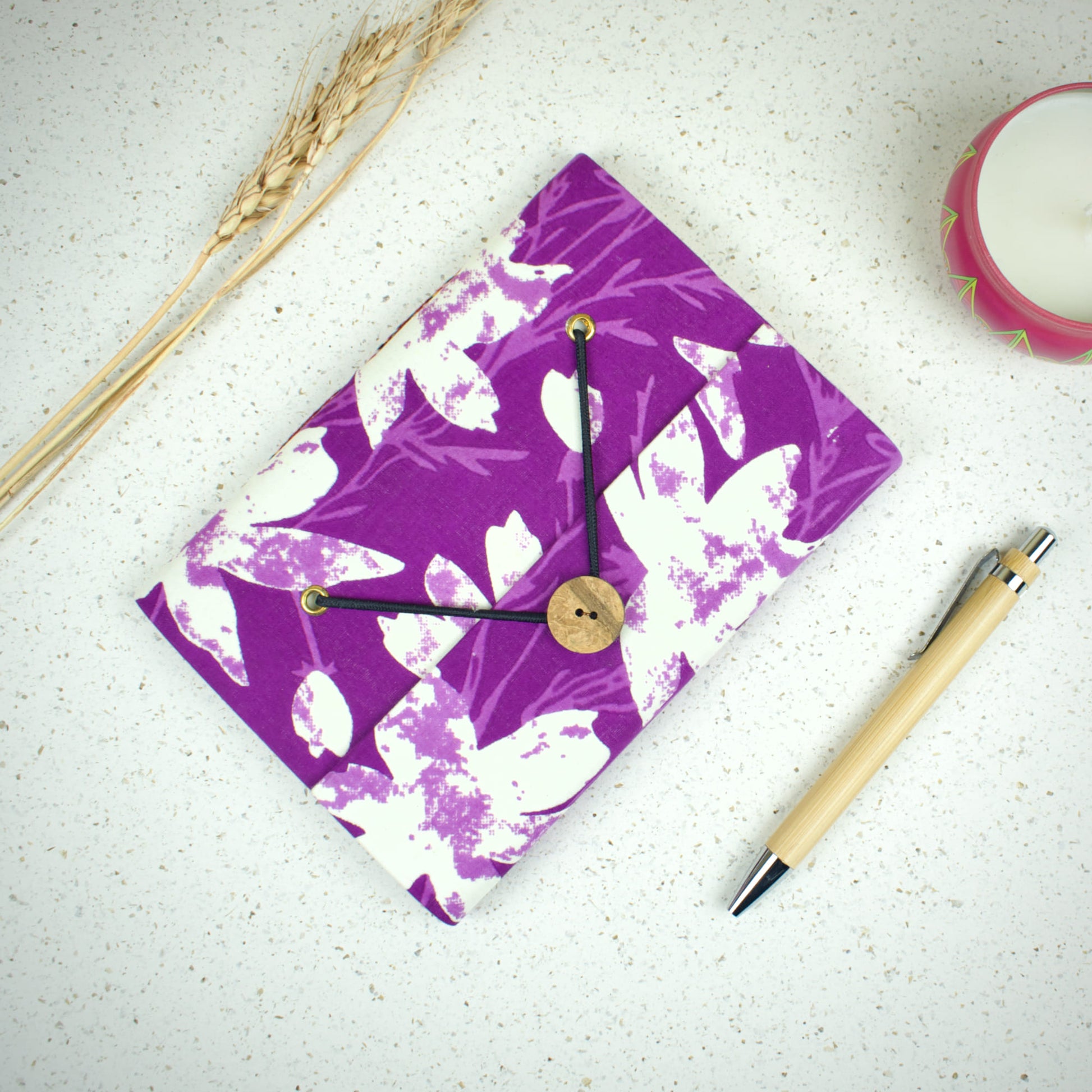 Abstract Purple Diary styled flatlay with writing accessories