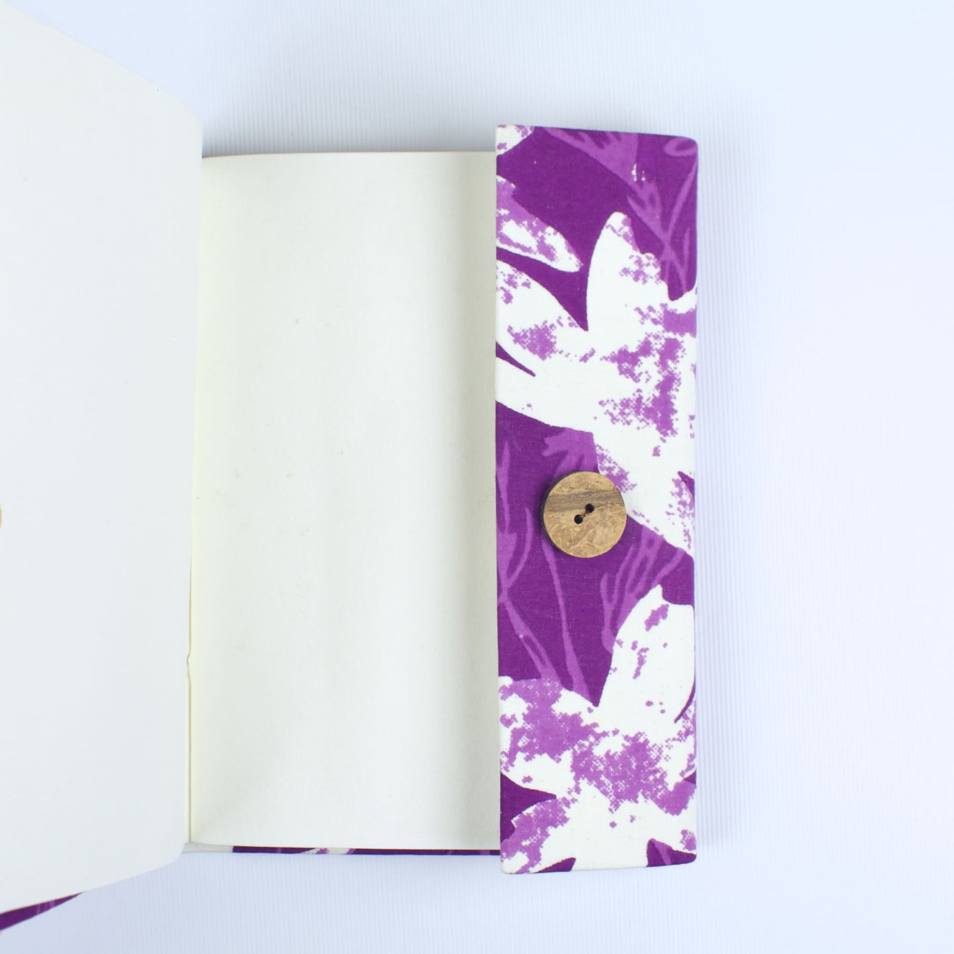 Abstract Purple Diary opened to show handmade paper pages