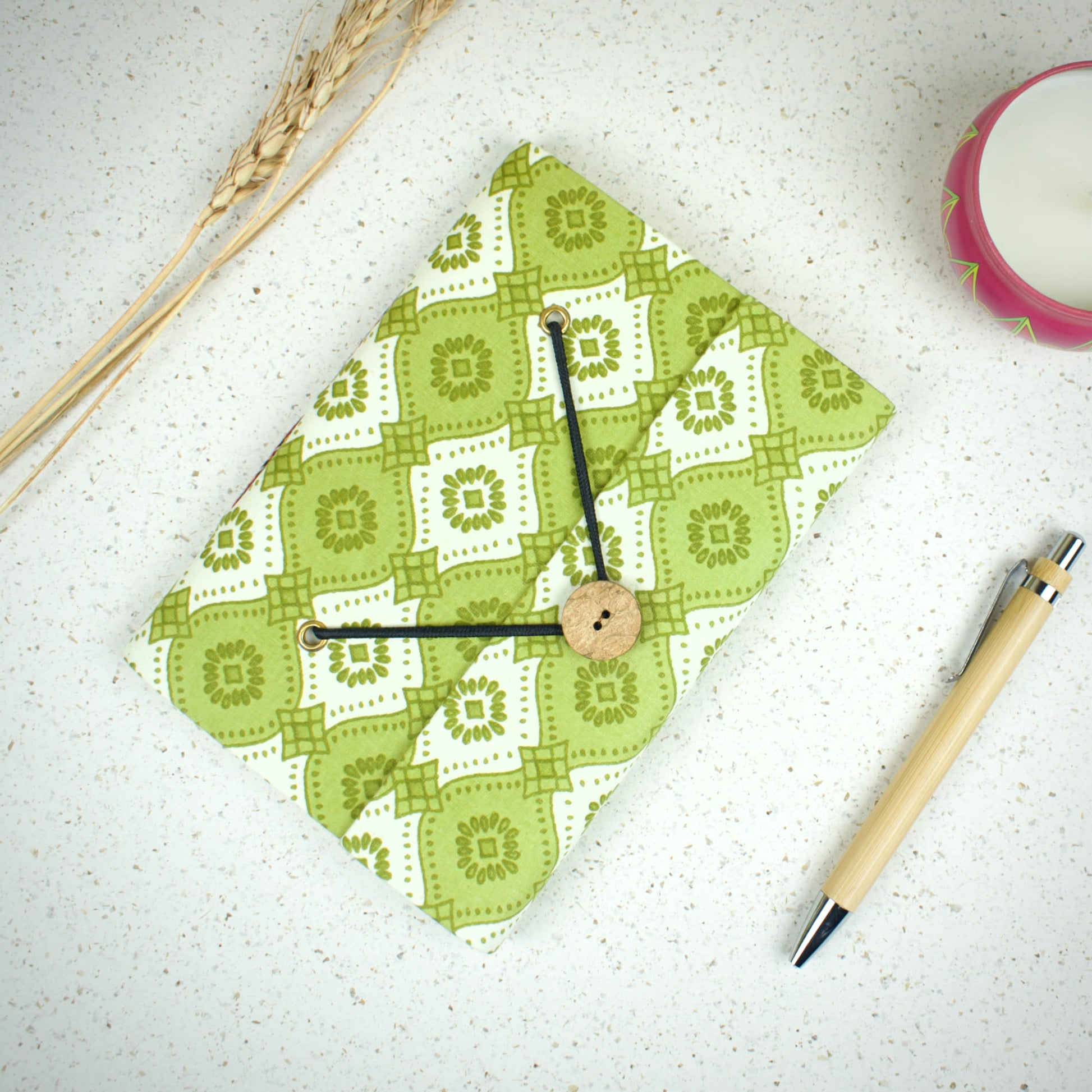 Geometric Green Diary styled flatlay with writing accessories