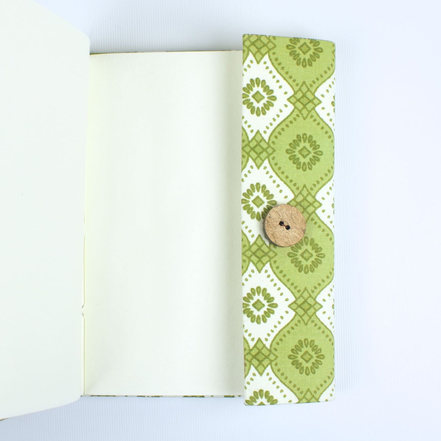 Geometric Green Diary opened to show handmade paper pages