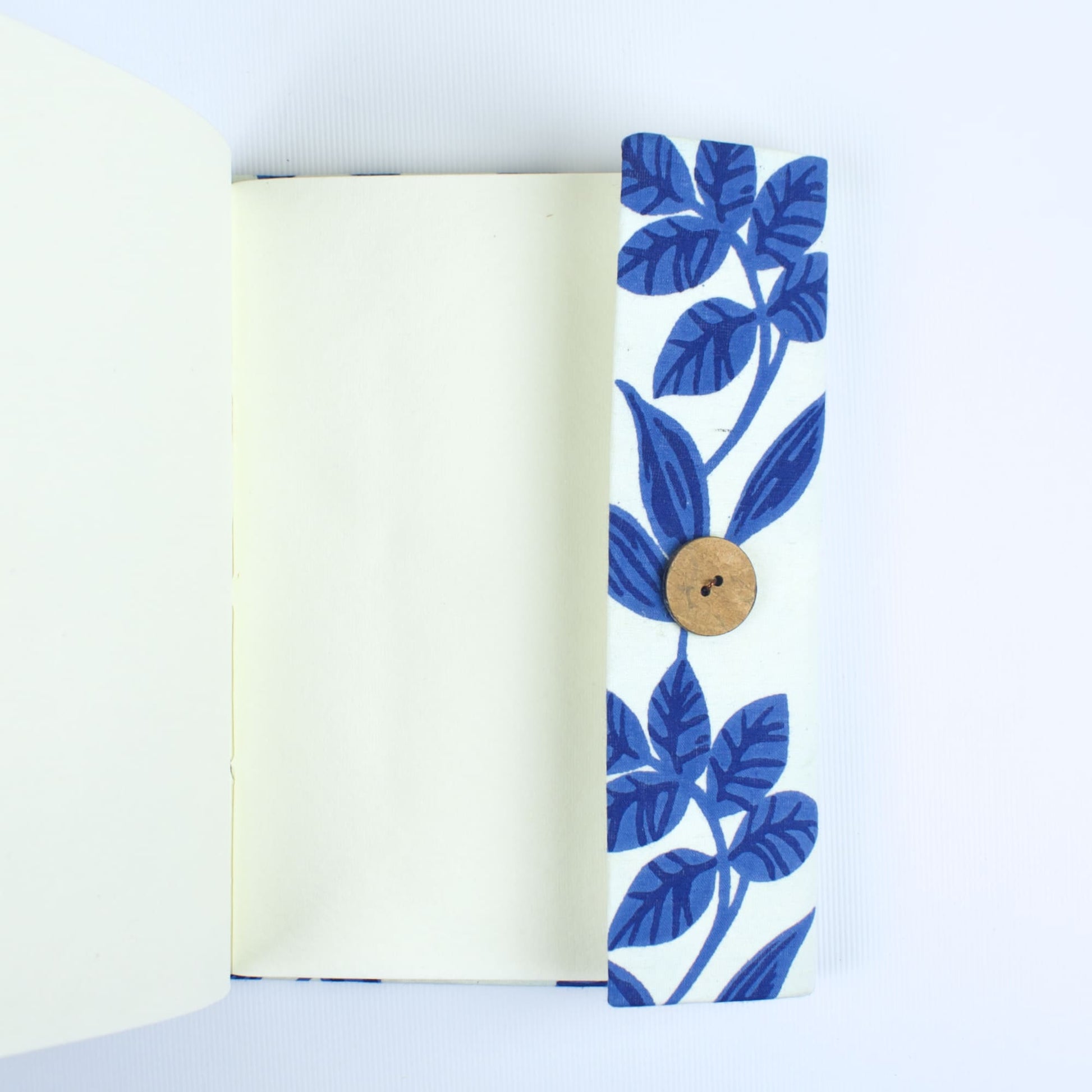Botanical Blue Diary opened to show handmade paper pages