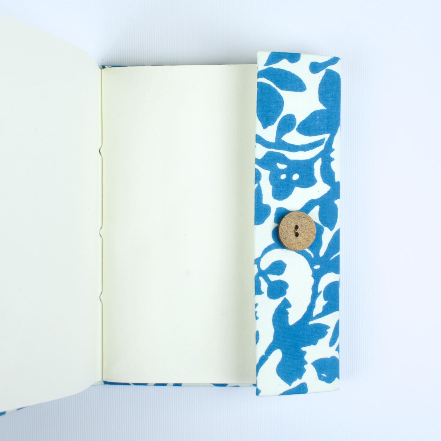 Abstract Blue Diary opened to show handmade paper pages