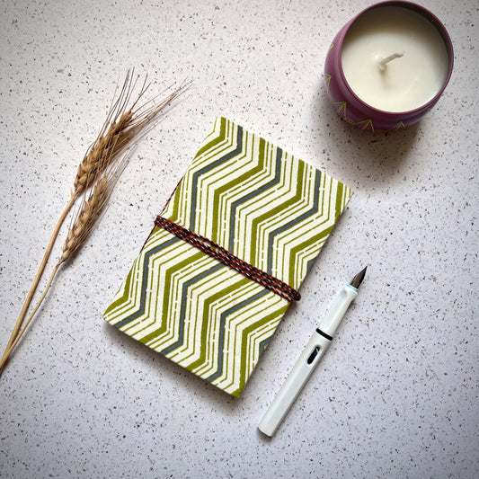 Chevron Green Diary styled flatlay with writing accessories