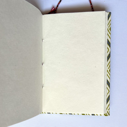 Chevron Green Diary opened to show handmade paper pages