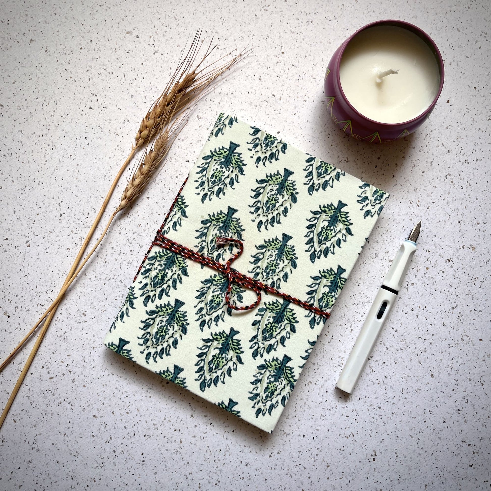 Tree Motif Green Diary styled flatlay with writing accessories