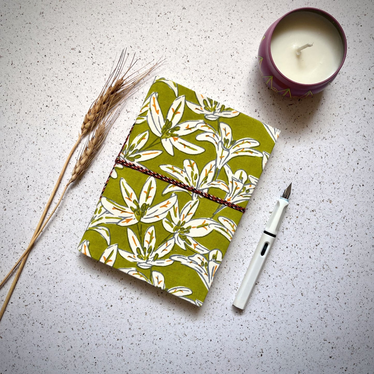 Lily Floral Green Diary styled flatlay with writing accessories