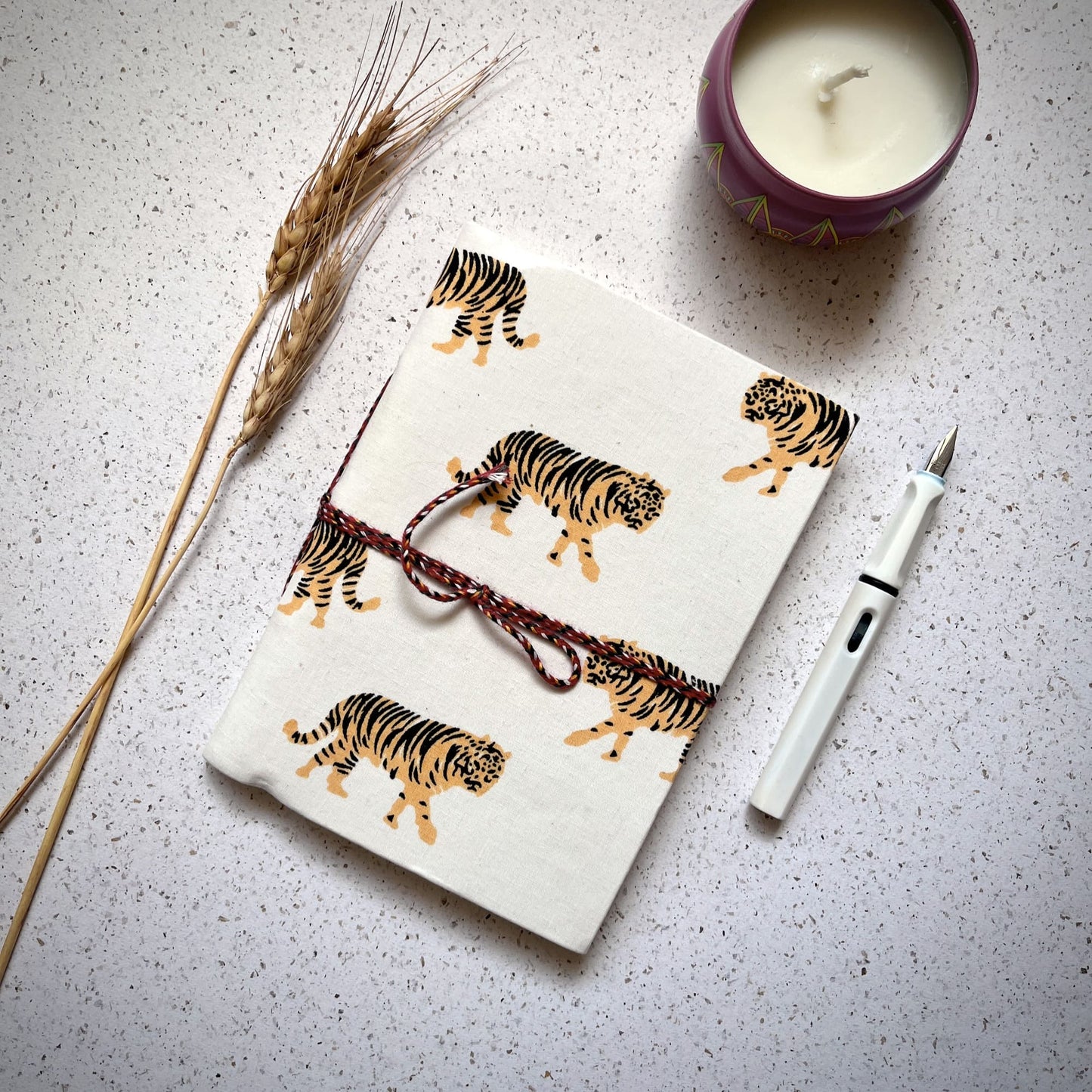 Tiger Print Yellow Diary styled flatlay with writing accessories