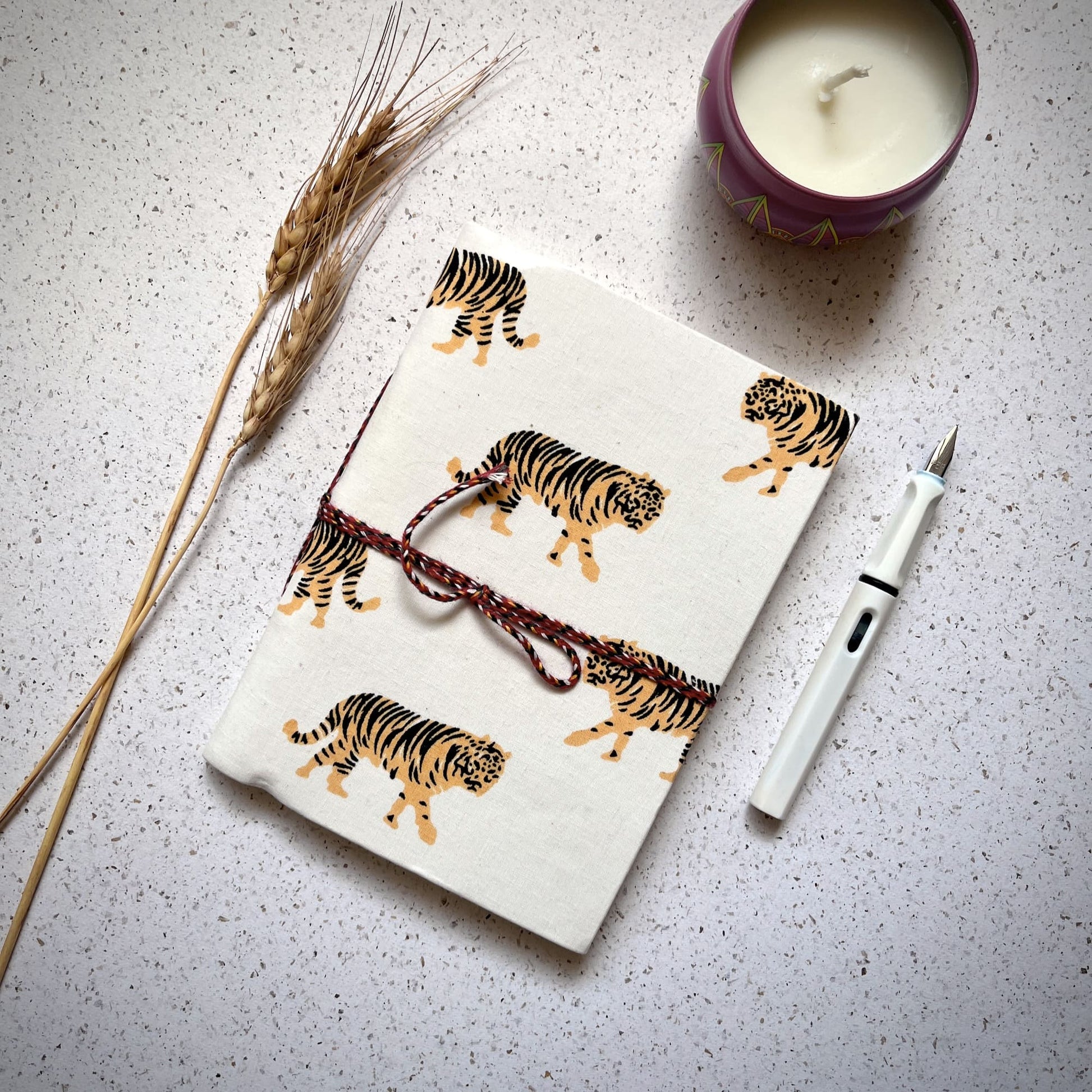 Tiger Print Yellow Diary styled flatlay with writing accessories