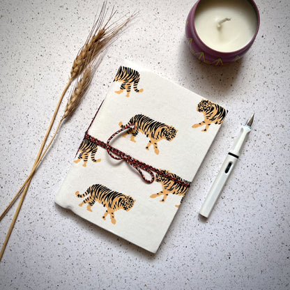Tiger Print Yellow Diary styled flatlay with writing accessories