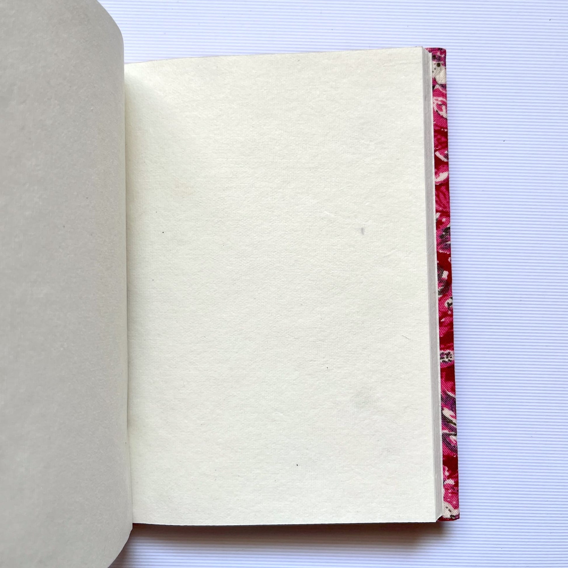 Floral Vine Pink Diary opened to show handmade paper pages