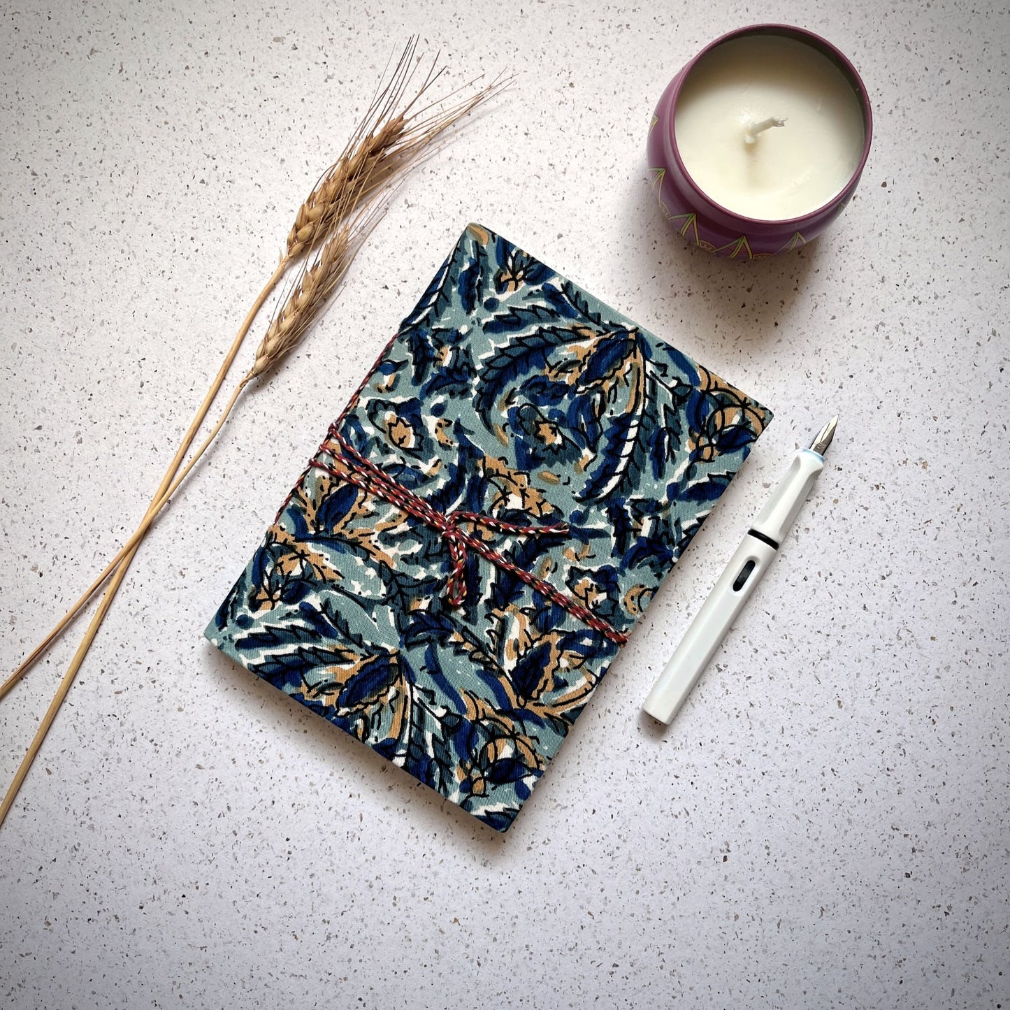 Indigo Floral Blue Diary styled flatlay with writing accessories