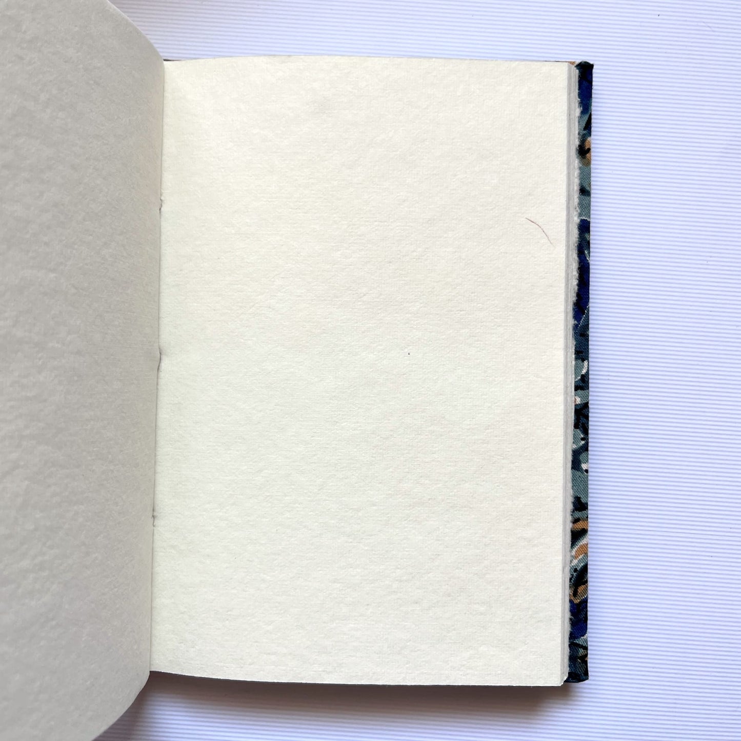 Indigo Floral Blue Diary opened to show handmade paper pages