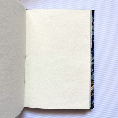 Indigo Floral Blue Diary opened to show handmade paper pages