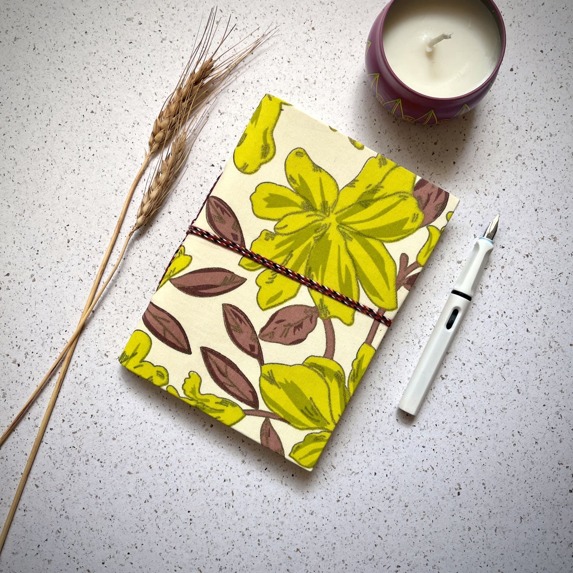 Large Floral Green Diary styled flatlay with writing accessories