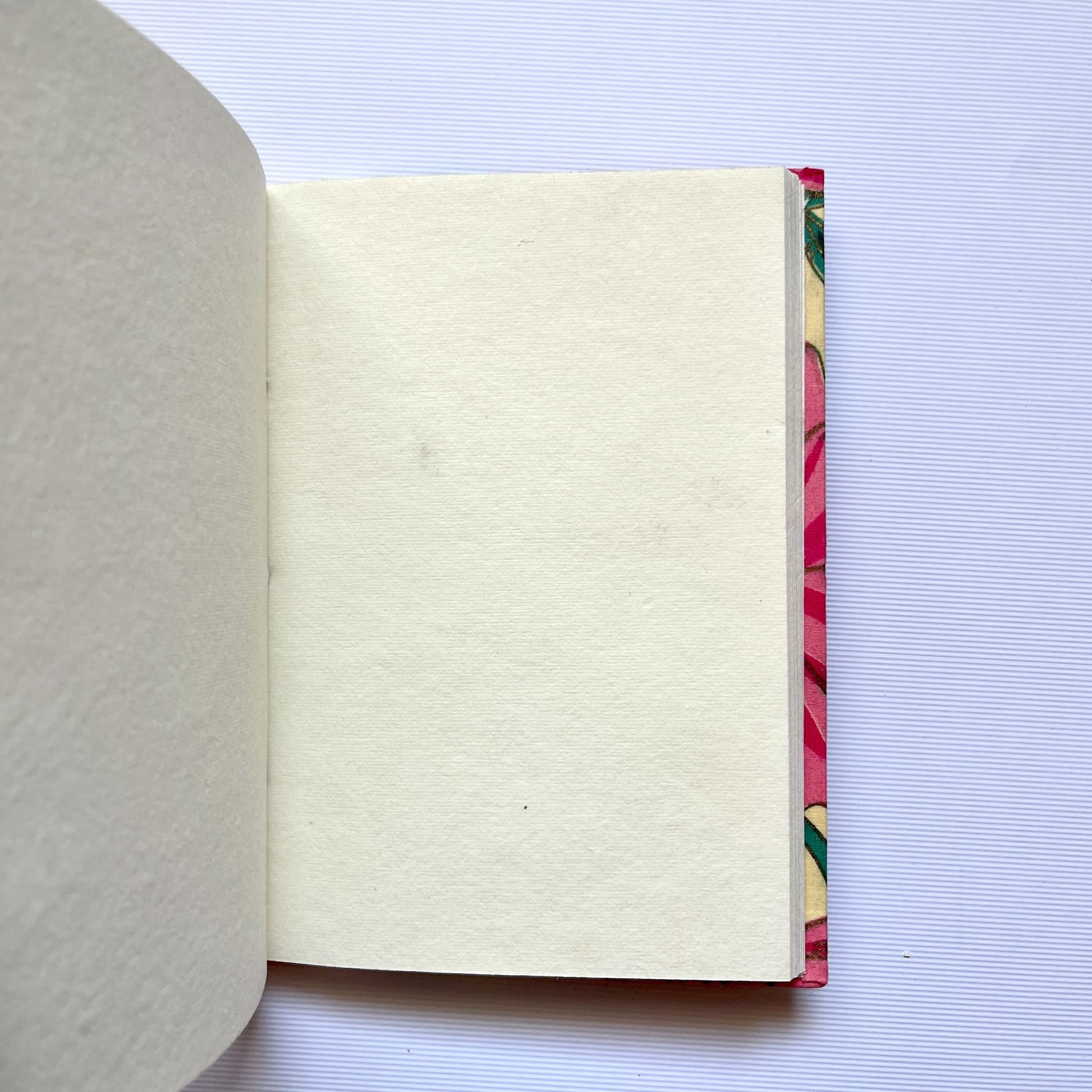 Magnolia Floral Pink Diary opened to show handmade paper pages