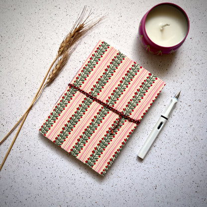 Berry Stripe Pink Diary styled flatlay with writing accessories