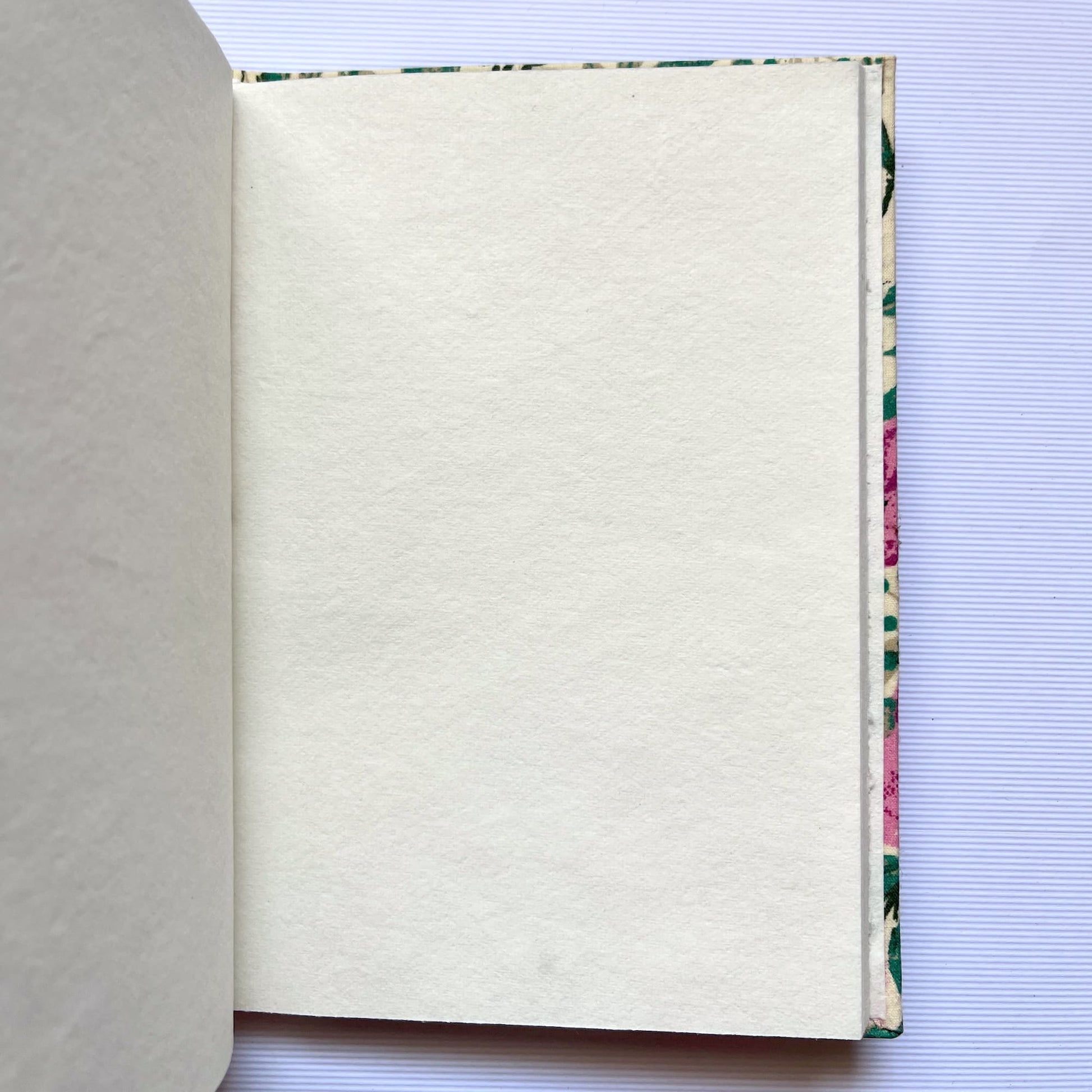 Garden Floral Pink Diary opened to show handmade paper pages