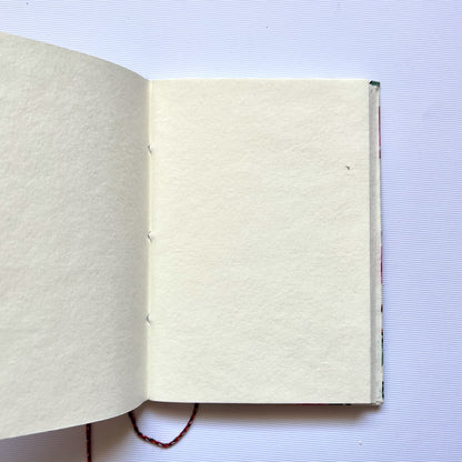 Owl Print Red Diary opened to show handmade paper pages