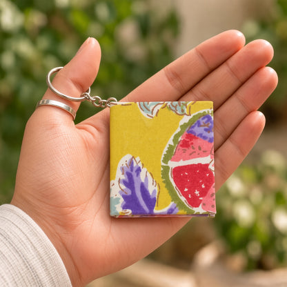 Yellow Fruit keychain diary in hand