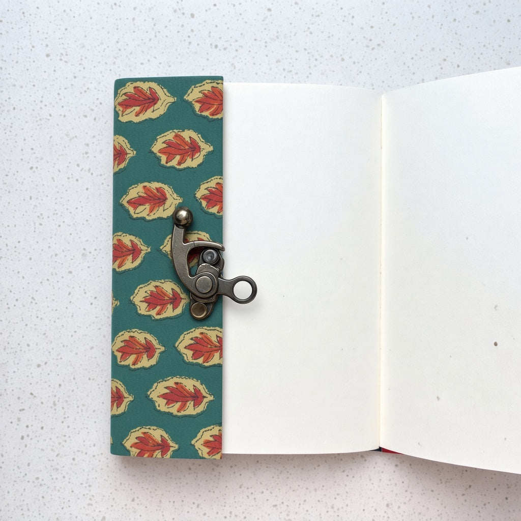 Green Leaf lock diary opened to show handmade paper pages